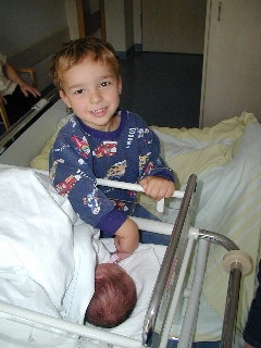 [Marcus (3 years old) meets his little sister, 25 June 2004]