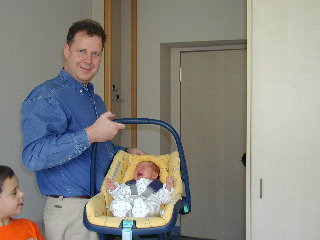 [Dad picks Marie (four days old) up from the hospital, 28 June 2004]
